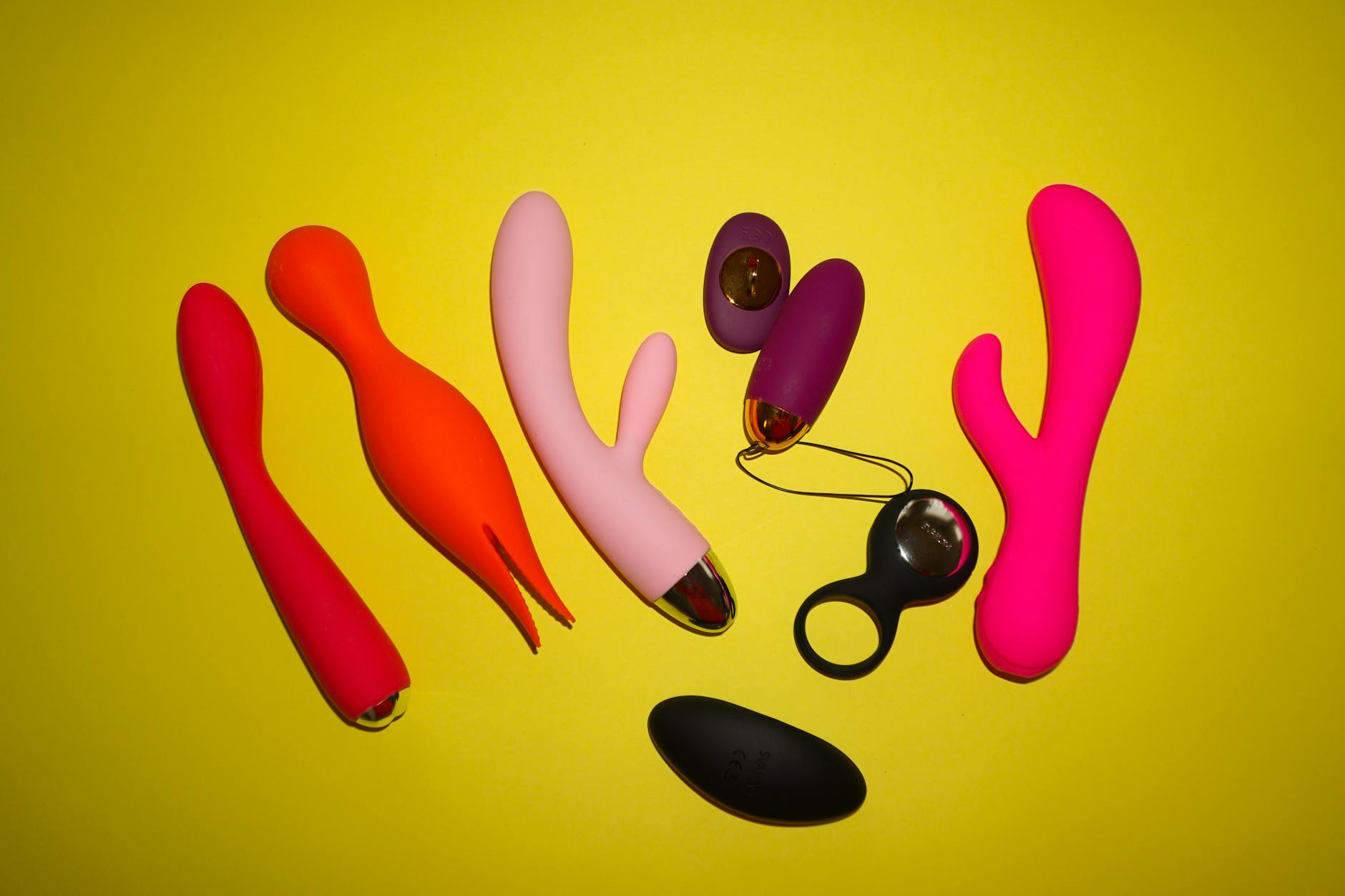 Colorful vibrators displayed in studio setting, showcasing variety of toy options
