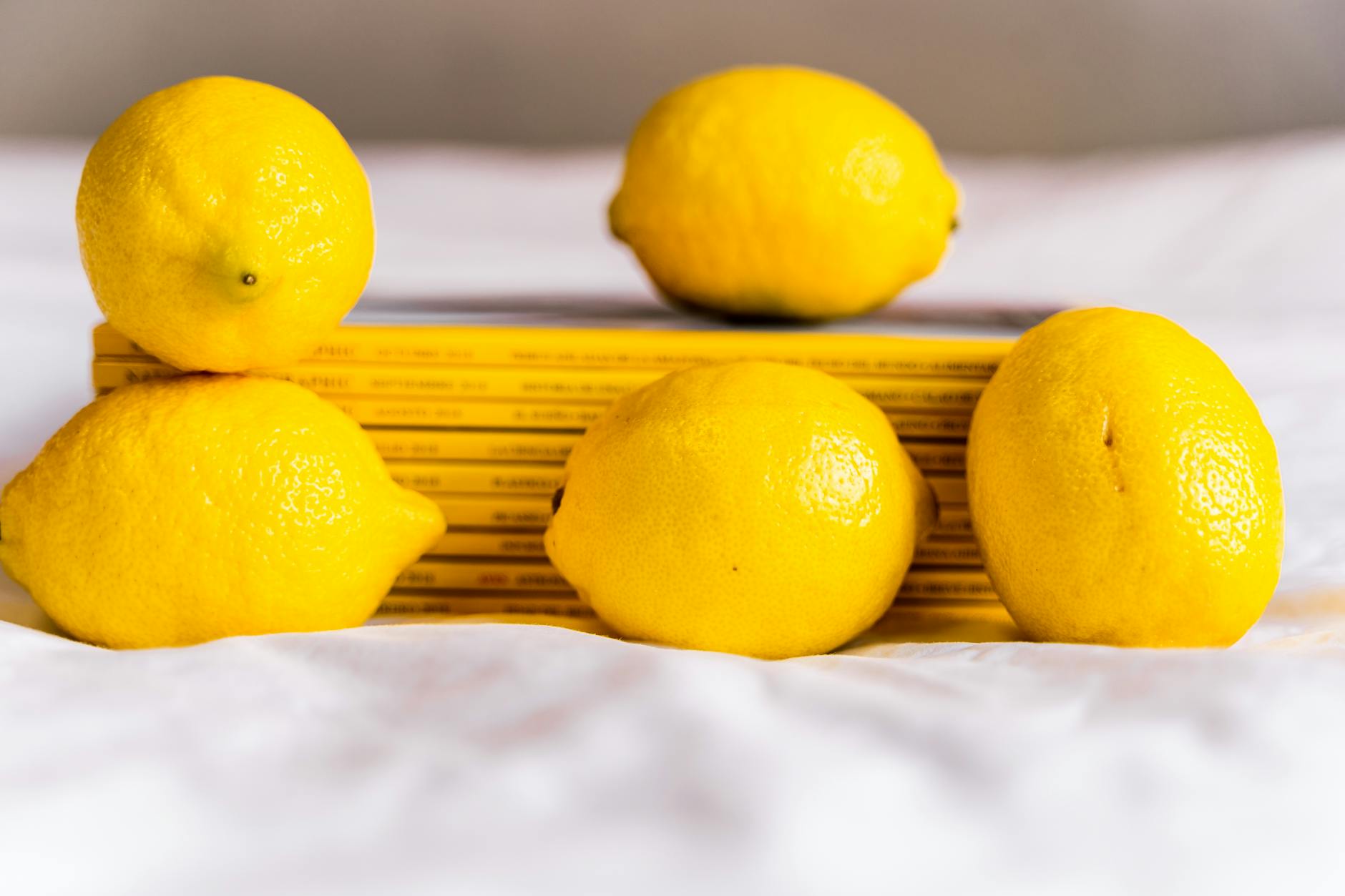 Vibrant yellow lemons on a pastel green background representing fresh desire and renewal
